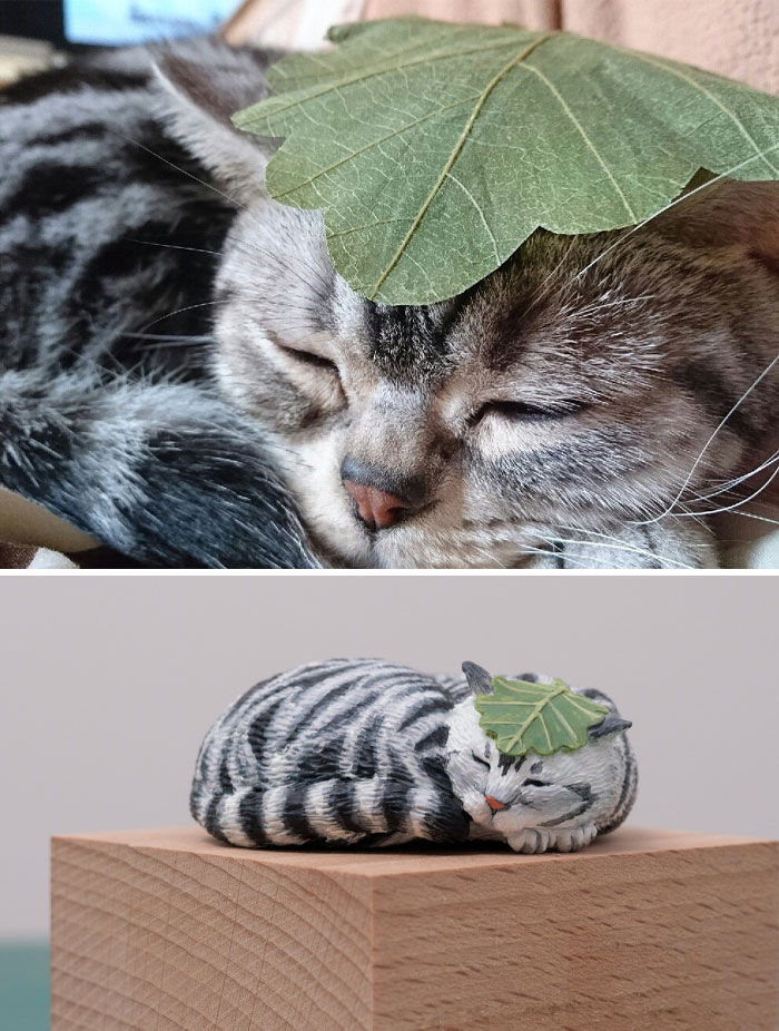 葉っぱをかぶって眠る猫のフィギュア
