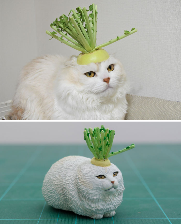 大根を頭に乗せた猫のフィギュア